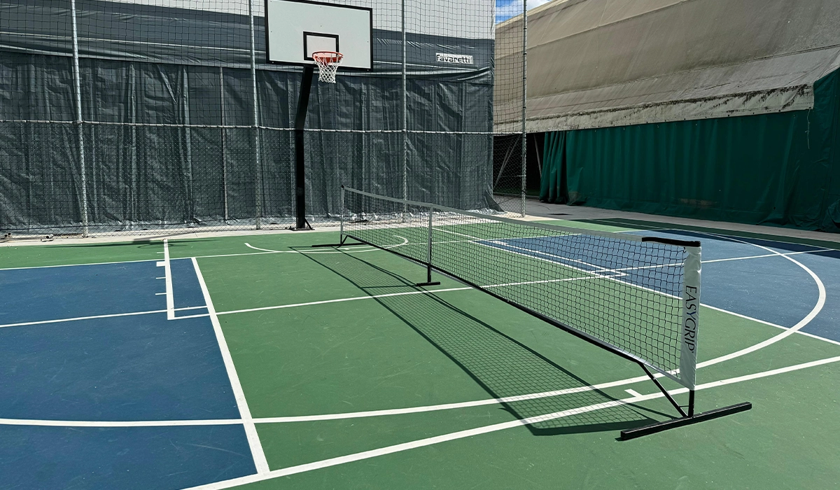 Realizzazione campo da pickleball e basket a Montecchio Emilia (Reggio Emilia) Claudio Cocconi. Con pavimentazione ad alte prestazioni. Soluzioni durevoli, sicure e personalizzate per impianti sportivi moderni